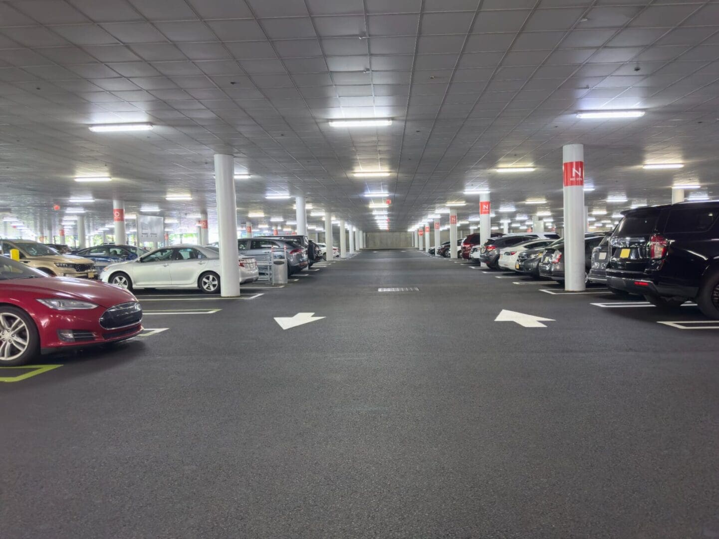 Indoor parking lot with parked cars.